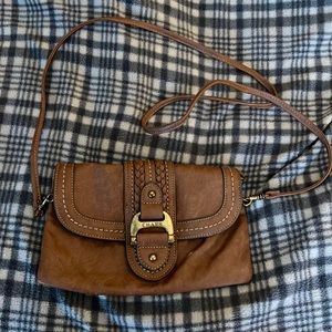 Tan chaps cross body.